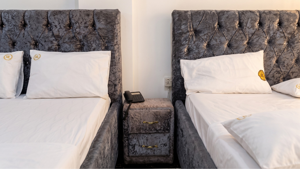 JENNABWA executive suite with tufted headboards